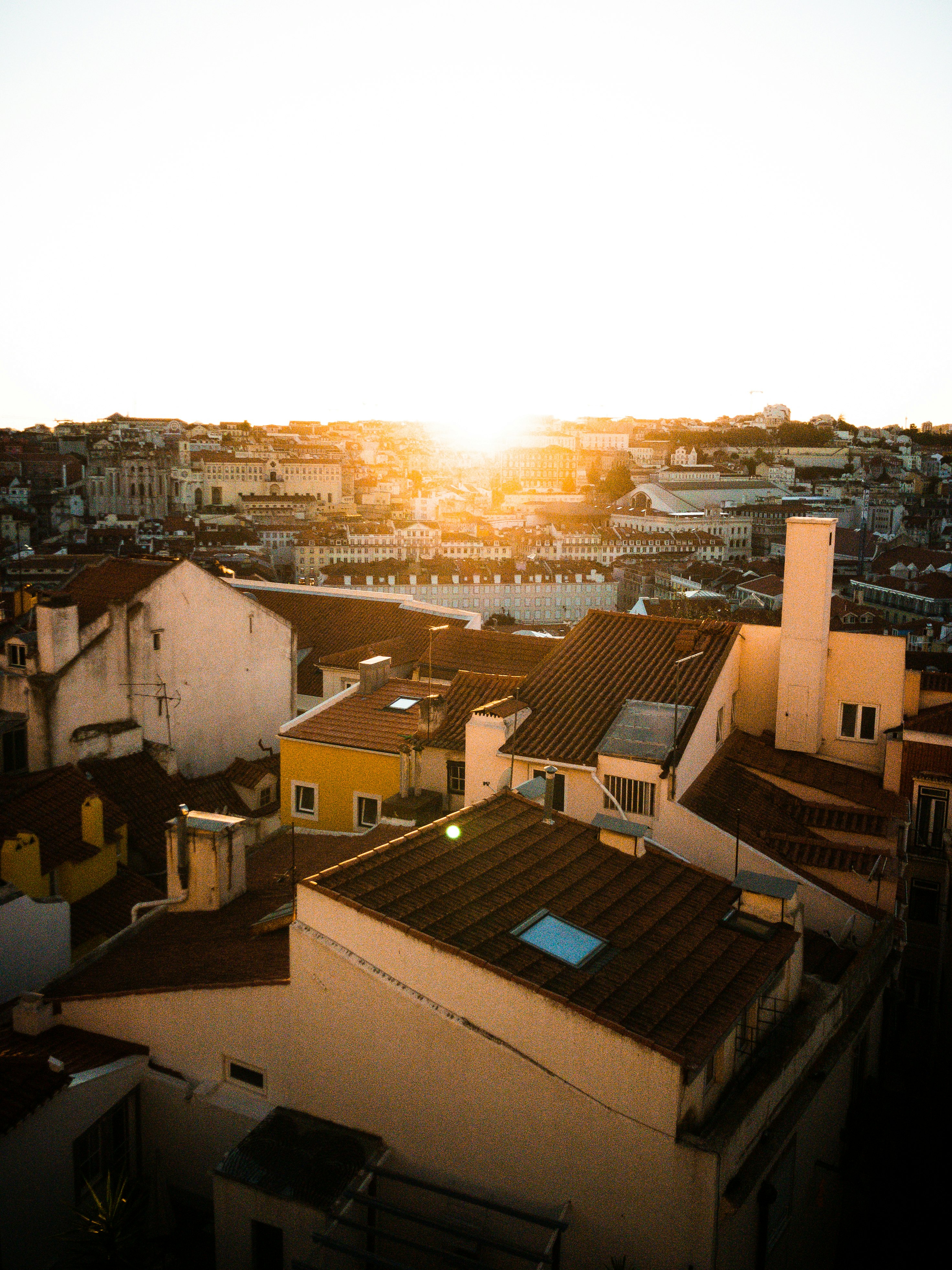 white and brown houses during sunset